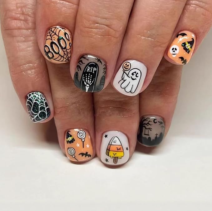 Halloween nail art with ghosts, webs, and candy