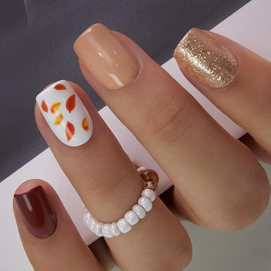 Autumn-Inspired Brown Nails with Glitter and Leaf Design
